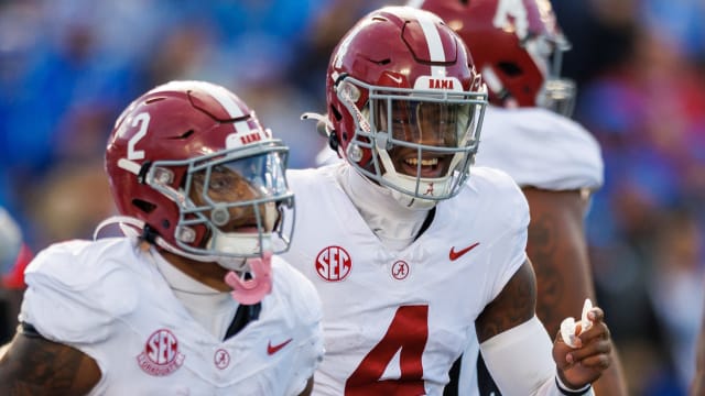 Nov 11, 2023; Lexington, Kentucky, USA; Alabama Crimson Tide quarterback Jalen Milroe (4) smiles as he runs back to the sideline during the third quarter against the Kentucky Wildcats at Kroger Field.